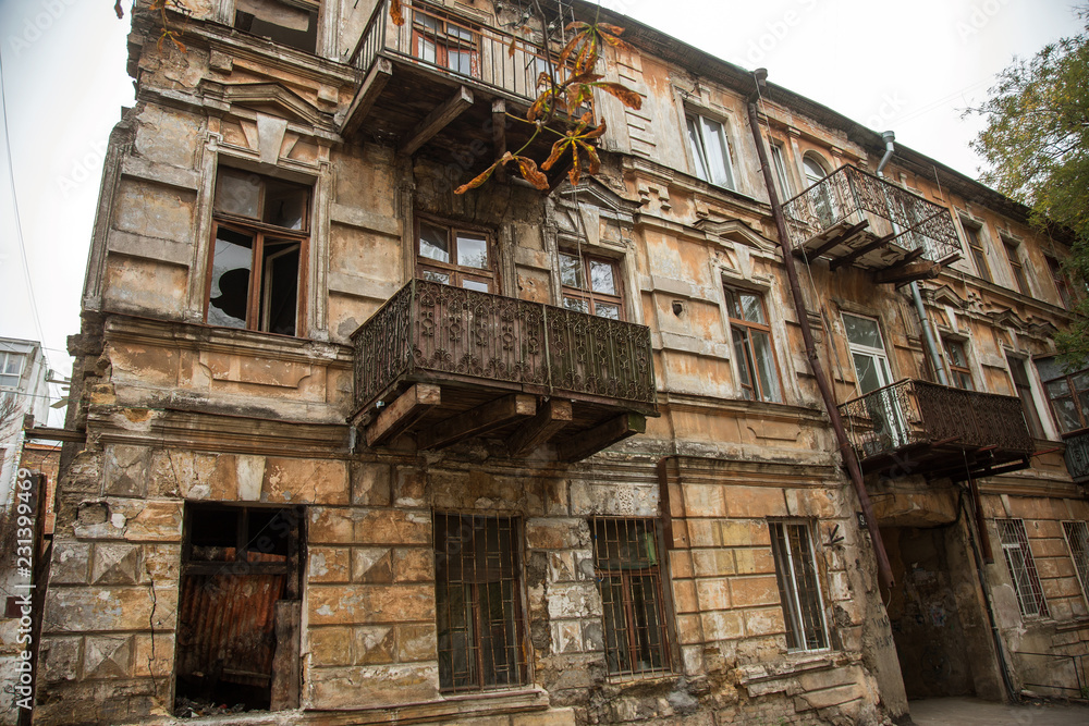 Ruins of an old abandoned city. Ruined house in which poor people live. Odessa, the ruins of a historic residential building. The ruins of an old earthquake-hit house. Lost city. Ruins of an old abandoned city. Ruined house in which poor people live. Odessa, the ruins of a historic residential building. The ruins of an old earthquake-hit house. Lost city.