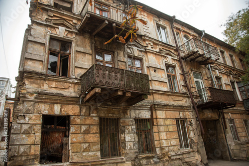 Ruins of an old abandoned city. Ruined house in which poor people live. Odessa, the ruins of a historic residential building. The ruins of an old earthquake-hit house. Lost city.