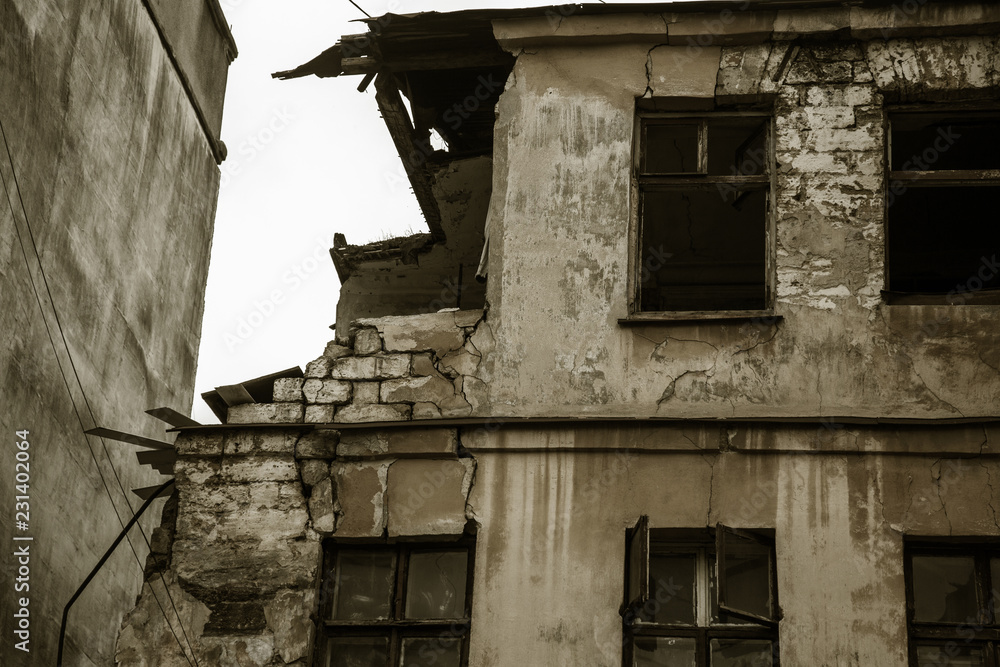 Ruins of an old abandoned city. Ruined house in which poor people live. Odessa, the ruins of a historic residential building. The ruins of an old earthquake-hit house. Lost city. Ruins of an old abandoned city. Ruined house in which poor people live. Odessa, the ruins of a historic residential building. The ruins of an old earthquake-hit house. Lost city.
