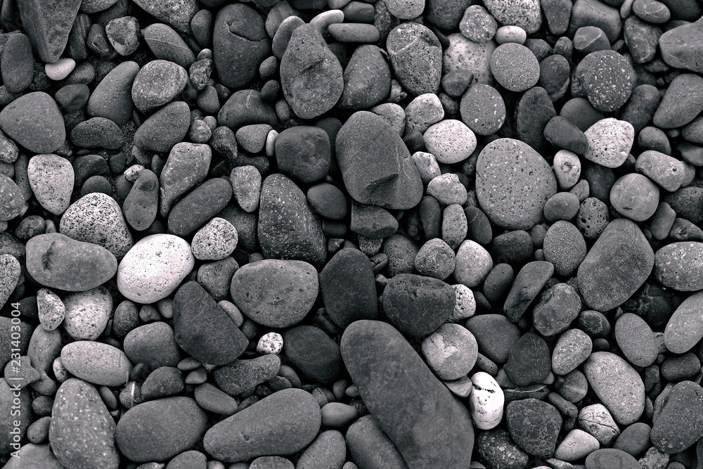 Various shapes and colors of River rocks and Pebbles , black and white background. Various shapes and colors of River rocks and Pebbles , black and white background.