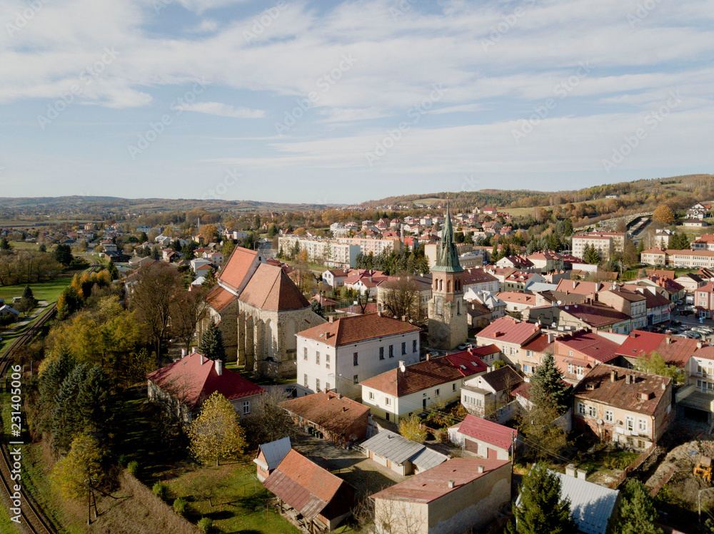 Fototapeta premium Strzyzow, Poland - 9 9 2018: Photograph of the old part of a small town from a bird's flight. Aerial photography by drone or quadrocopter. Advertise tourist places in Europe. Planning a medieval town.