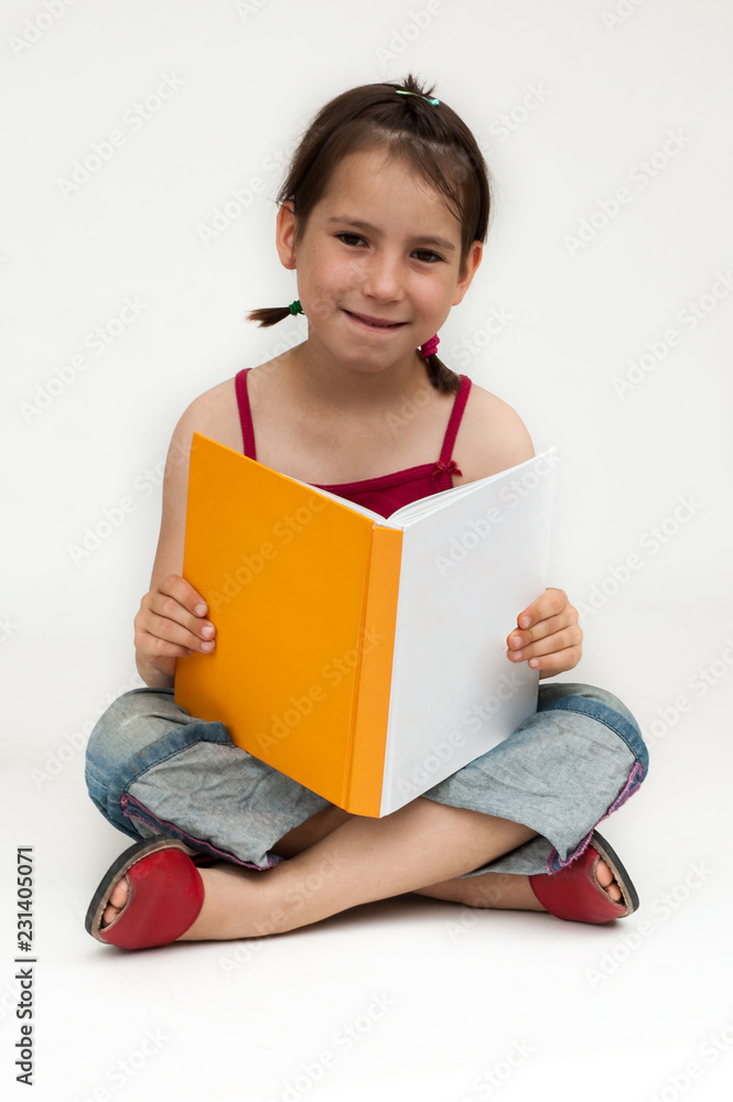 young girl reading a book isolated on white background young girl reading a book isolated on white background