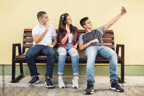 Three teenagers taking a selfie