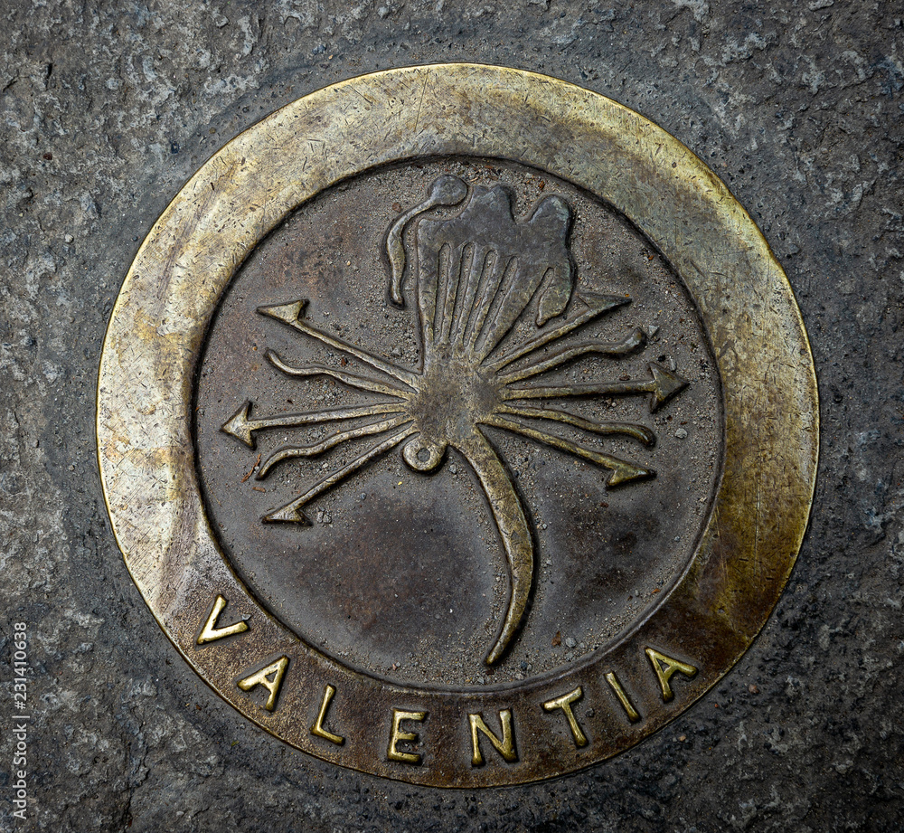 metallic symbol of Valencia city (Valentia in Latin) on the floor