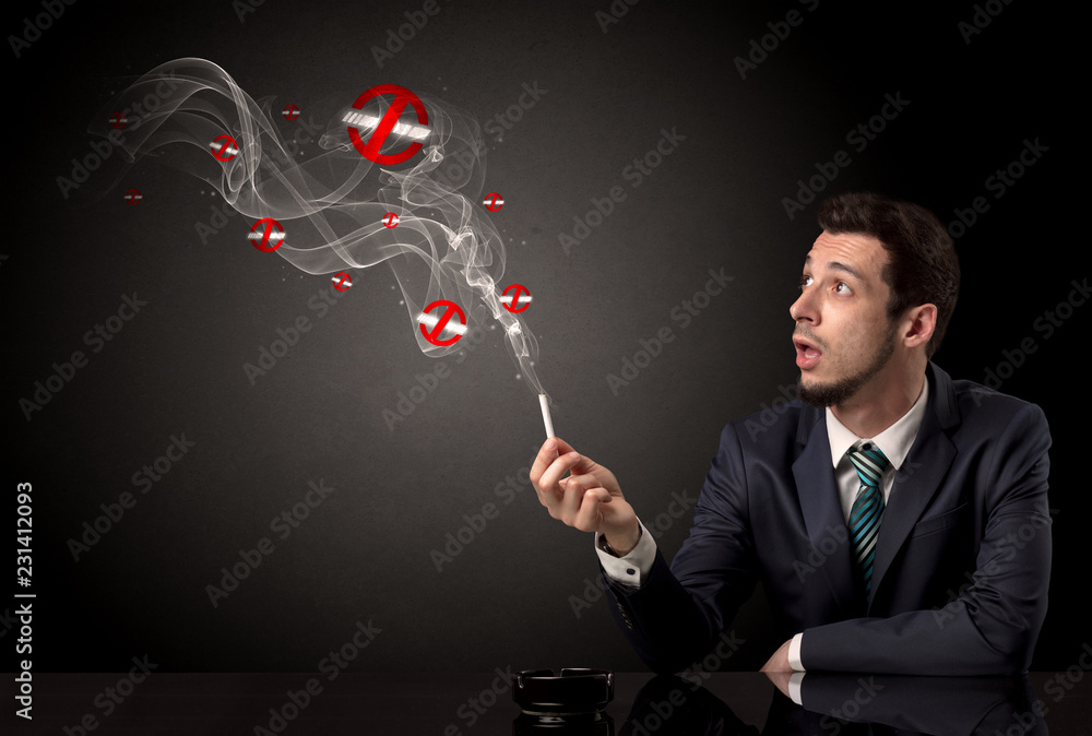 Businessman smoking with colored no smoking symbols nearby. Businessman smoking with colored no smoking symbols nearby.