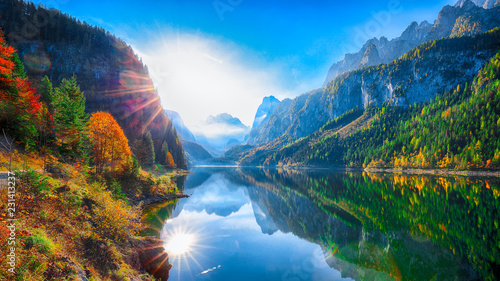 Fototapeta Naklejka Na Ścianę i Meble -  autumn scenery with Dachstein mountain summit reflecting in crystal clear Gosausee mountain lake