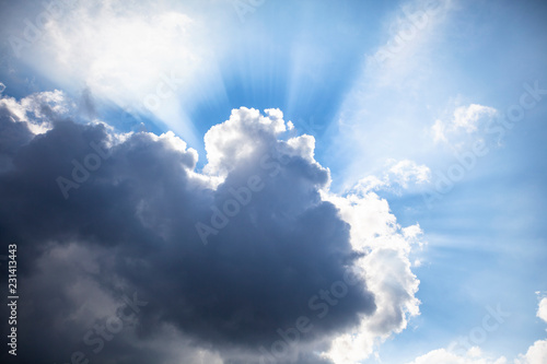 blue sky with clouds and sun rays