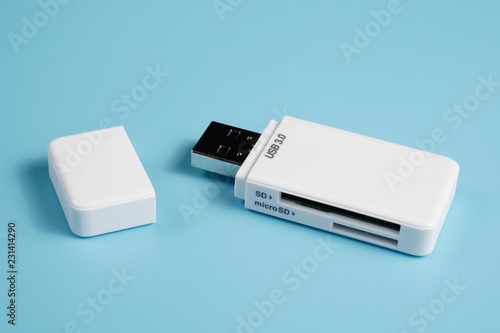 A USB 3.0 SD and microSD card reader isolated blue background