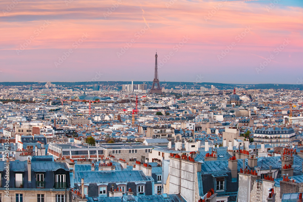 Aerial panoramic view from Montmartre over Paris roofs and Eiffel tower at nice sunrise, Paris, France