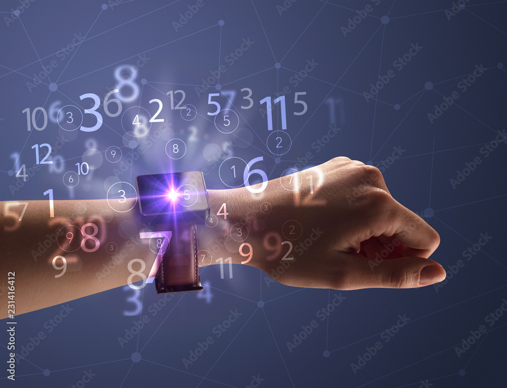 Close up female naked hand wearing smartwatch and numbers around Close up female naked hand wearing smartwatch and numbers around