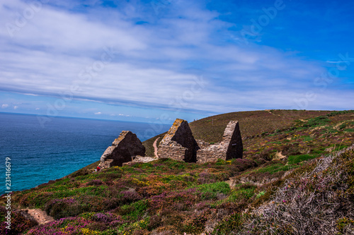 Stamps and wheel engine house ruins Wheal Coates mine on cliffs near St. Agnes,  Cornwall, UK photo