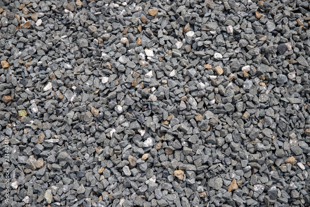 Grey gravel closeup photo for background. Sharp gray stones for construction. Gravel texture. Grey gravel closeup photo for background. Sharp gray stones for construction. Gravel texture.