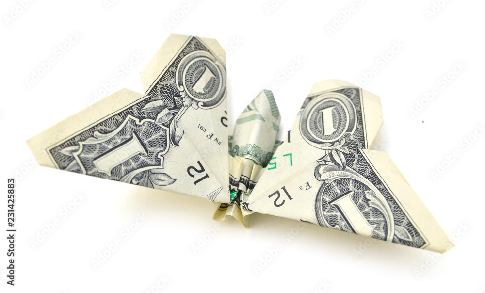 dollar folded origami style into a butterfly. Isolated on white background