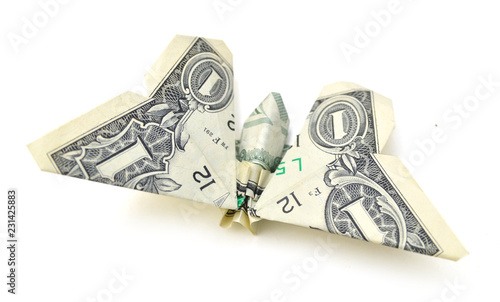 dollar folded origami style into a butterfly. Isolated on white background
