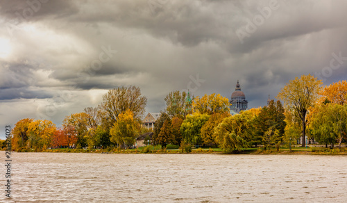 Lachine lakeshore showing the Paroisse Saints-Anges and the Collégial international Sainte-Anne next to the Fur Trade at Lachine National Historic Site on St Joseph Boulevard, Lachine, Quebec, Canada. photo