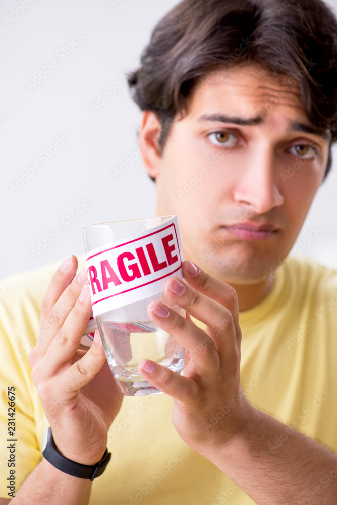 Man moving house and relocating with fragile items Man moving house and relocating with fragile items