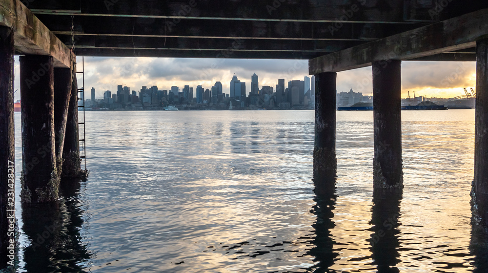 View of Downtown Seattle at sunset from under a Pier