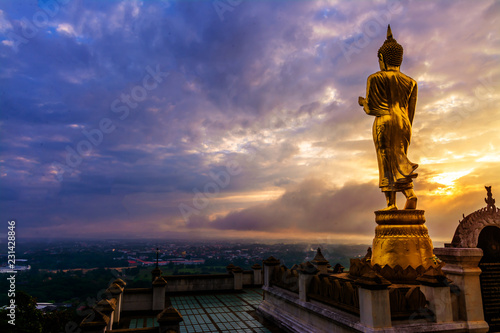 Great Golden Buddha statue at the Wat Phra That Kao Noi    Nan province  Thailand  with sky  Twilight time