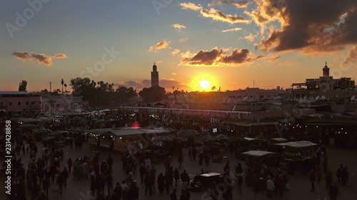 Famous Jemaa el Fna square crowded at sunset, Marrakesh, Morocco, timelapse 4k photo