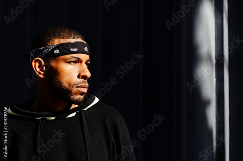 Profile portrait of a cool young man with a bandana