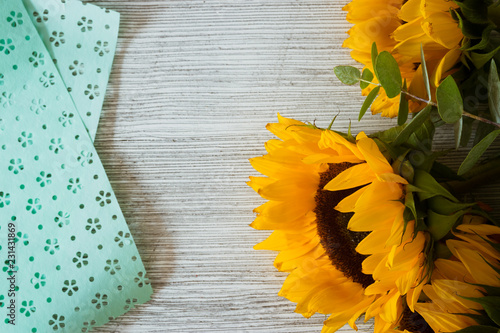 Fototapeta Naklejka Na Ścianę i Meble -  Sunflowers on wooden backgroundSunflowers on wooden background
