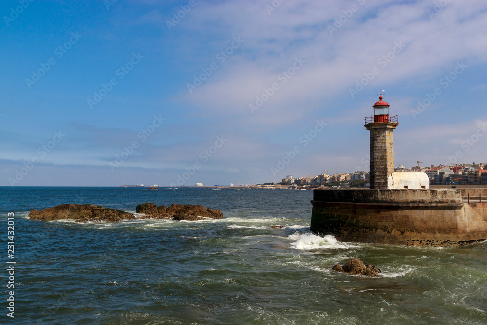 Lighthouse in Foz do Douro at the mouth of the river Douro in Porto, Portugal. Atlantic ocean. Travel photography.