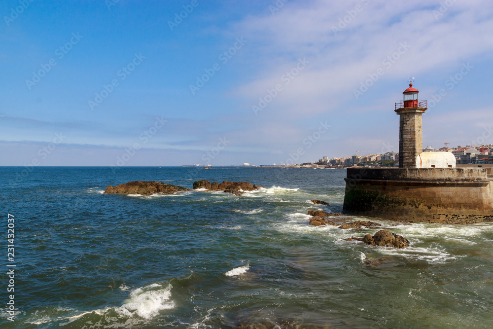 Lighthouse in Foz do Douro at the mouth of the river Douro in Porto, Portugal. Atlantic ocean. Travel photography.