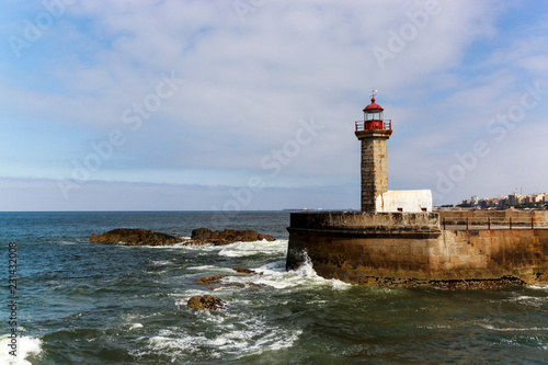 Lighthouse in Foz do Douro at the mouth of the river Douro in Porto, Portugal. Atlantic ocean.