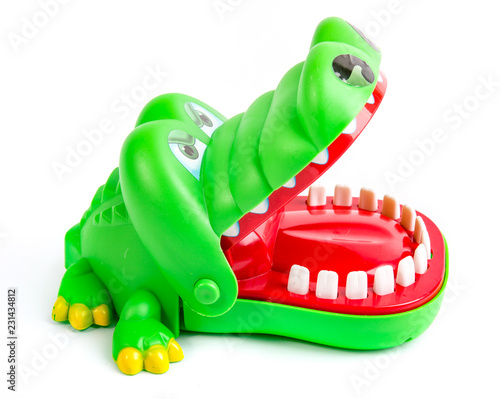 Alligator, green plastic crocodile toy on isolated