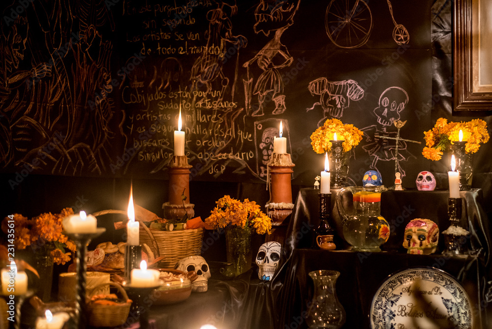 ofrenda mexicana altar de dia de muertos con velas calaveras y flores de  cempasuchil fondo negro y letras blancas Stock Photo | Adobe Stock