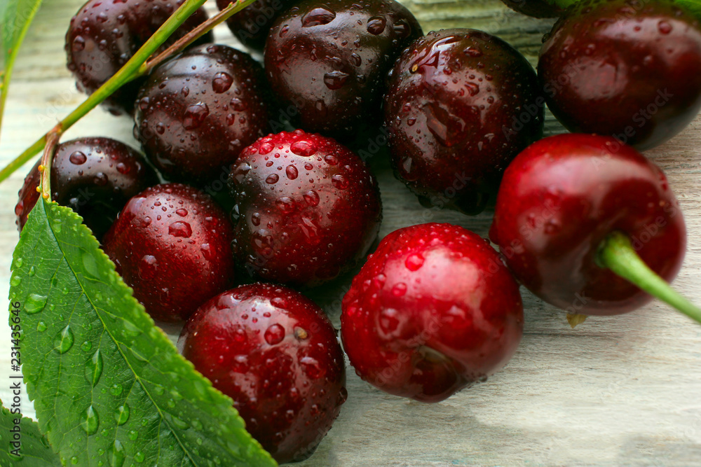 cherry ripe on a light background, closeup , berry of the season cherry ripe on a light background, closeup , berry of the season