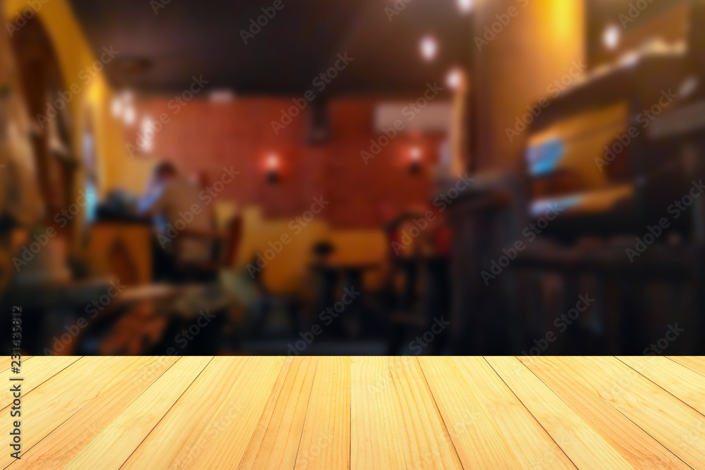 empty wooden table on on coffee shop background, with copy space