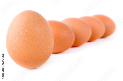 Five eggs are isolated on a white background