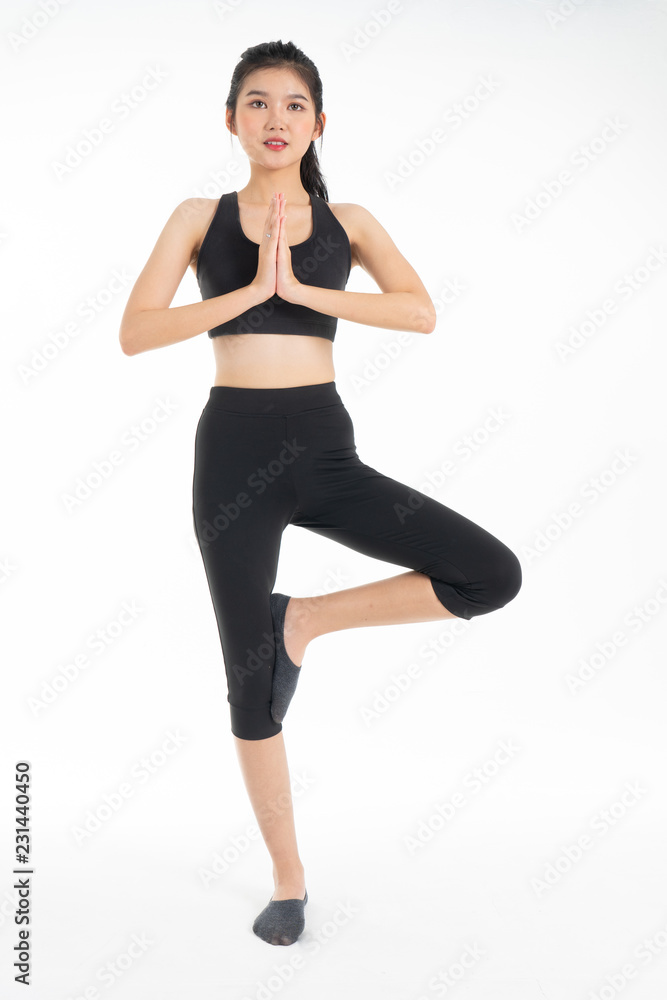 Sporty young asian woman doing yoga practice isolated on white background - concept healthy life fitness for slim. Sporty young asian woman doing yoga practice isolated on white background - concept healthy life fitness for slim.