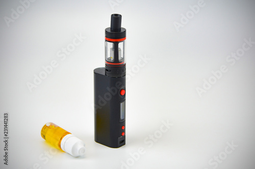E - cigarette for vaping , technical devices.The liquid in the bottle   