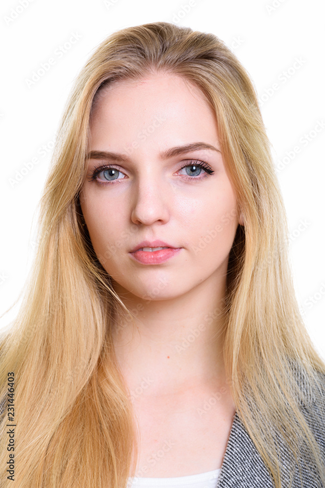 Face of young beautiful businesswoman looking at camera Face of young beautiful businesswoman looking at camera