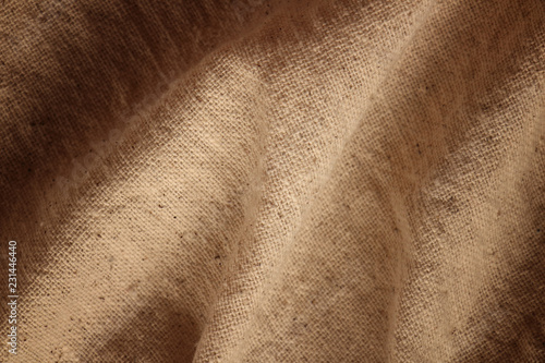 Background of natural brown cloth dark of the edges.