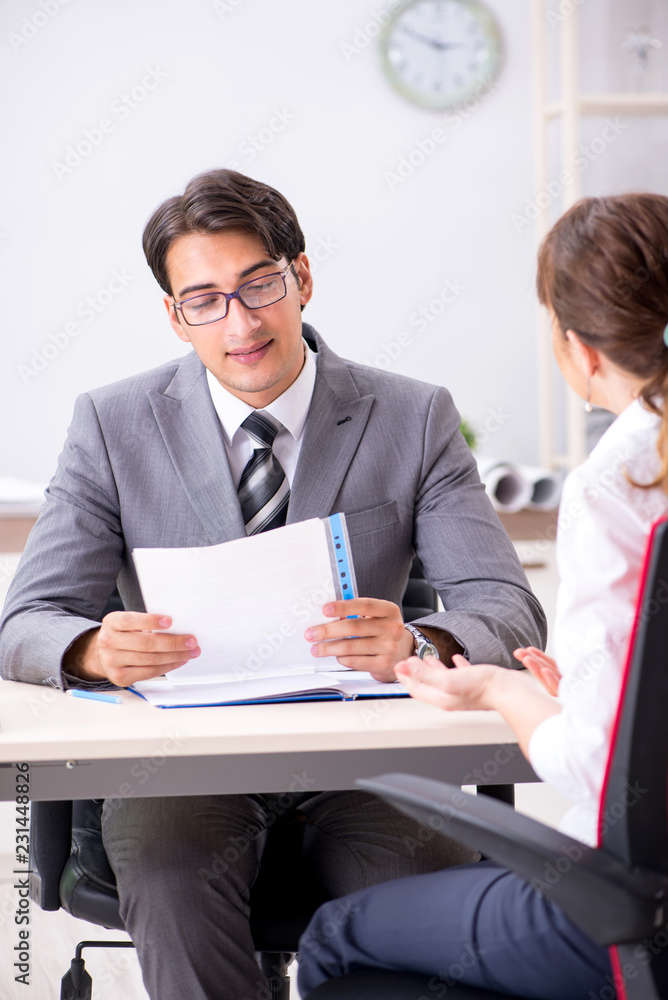 Man and woman discussing in office Man and woman discussing in office