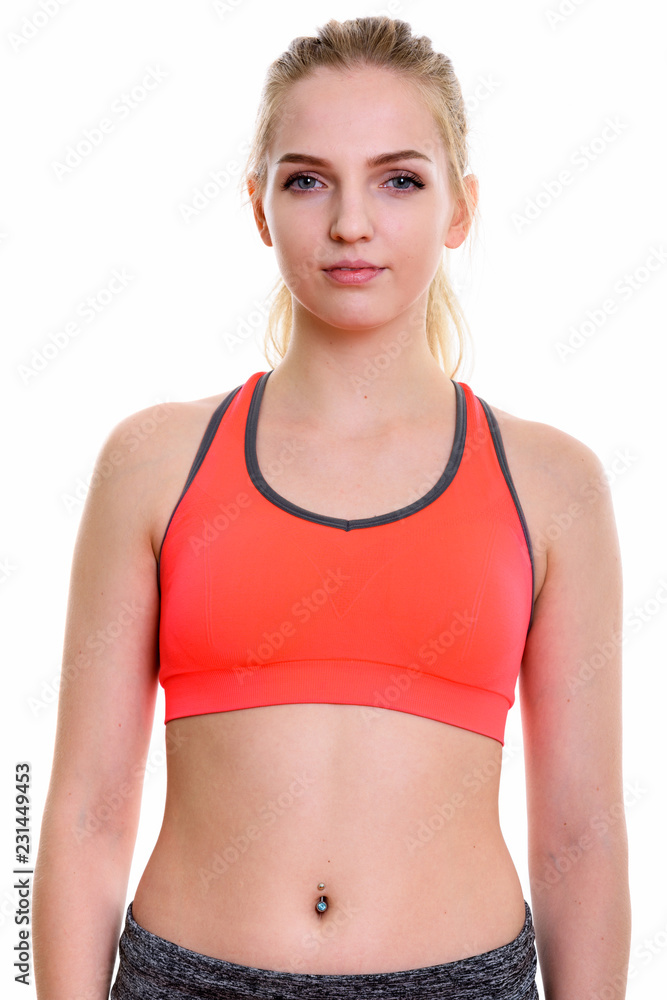 Studio shot of young beautiful teenage girl ready for gym Studio shot of young beautiful teenage girl ready for gym