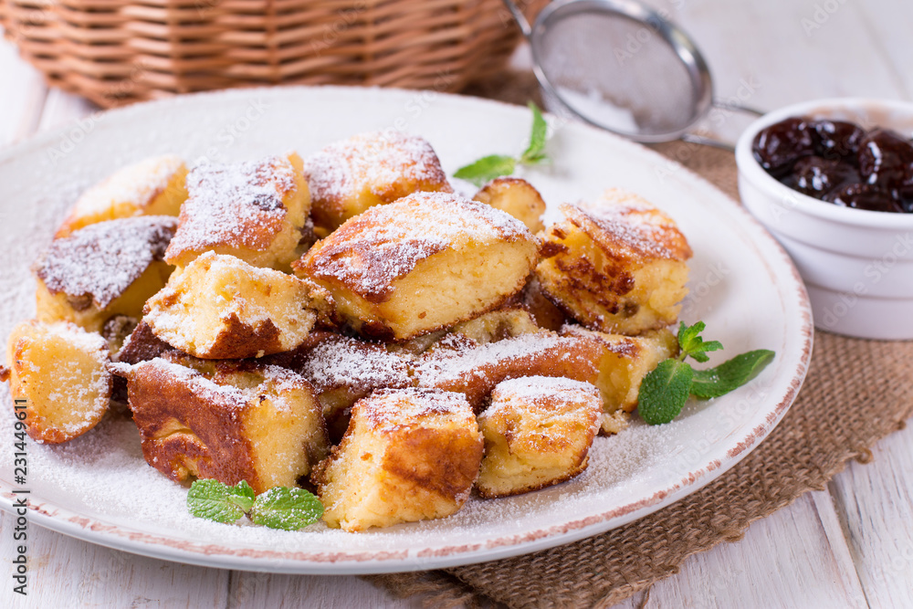 Kaiserschmarrn - traditional austrian pancake dessert with raisins Kaiserschmarrn - traditional austrian pancake dessert with raisins