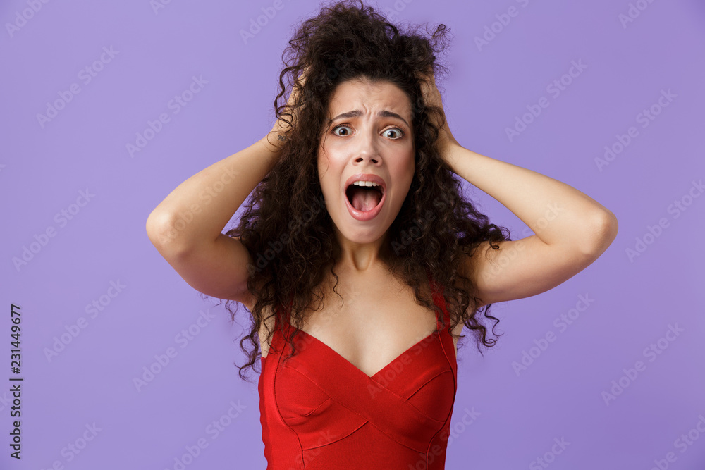 Portrait of a mad woman with dark curly hair Portrait of a mad woman with dark curly hair