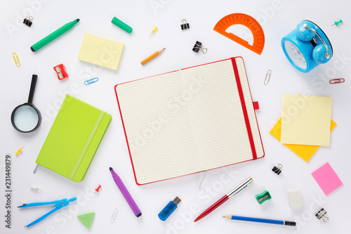 school accessories and open notebook or book