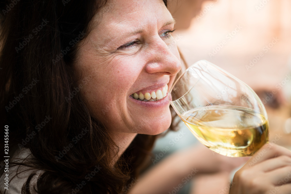 Happy woman with a glass of wine Happy woman with a glass of wine