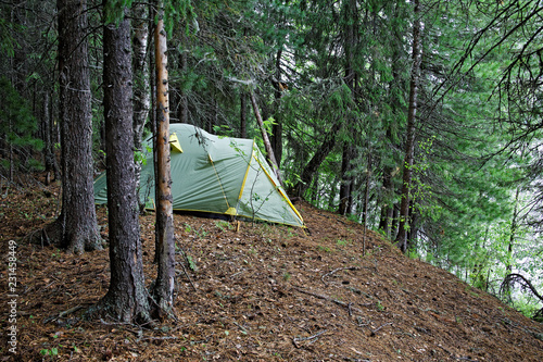 Obraz na płótnie Tent installed on the steep bank of a wild Siberian river w salonie