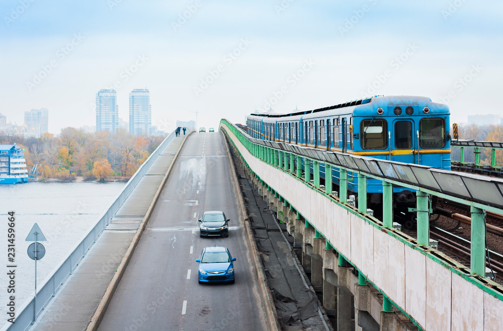 Naklejka premium Train on the metro subway bridge over the river Dnieper in Kiev, Ukraine