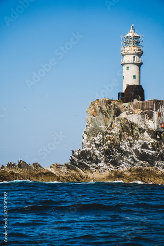 Fastnet lighthouse. A view from the boat photo