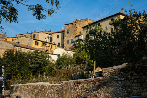 Roofs, towers and hills around the medieval town of Guardistallo in Tuscany - 3