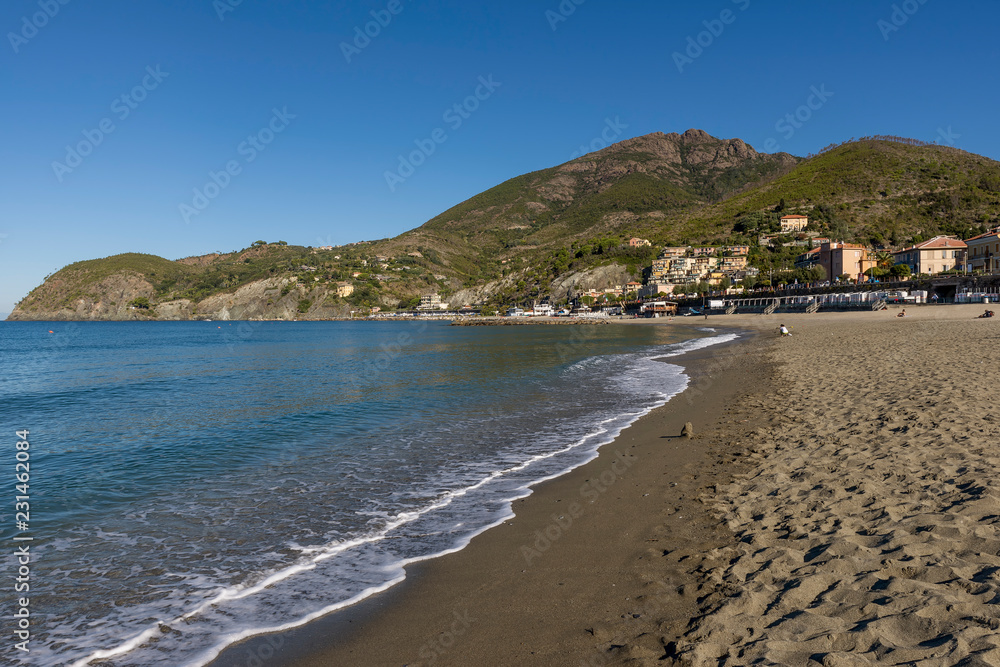 Levanto beach lit by the morning sun in a moment of tranquility, Liguria, Italy