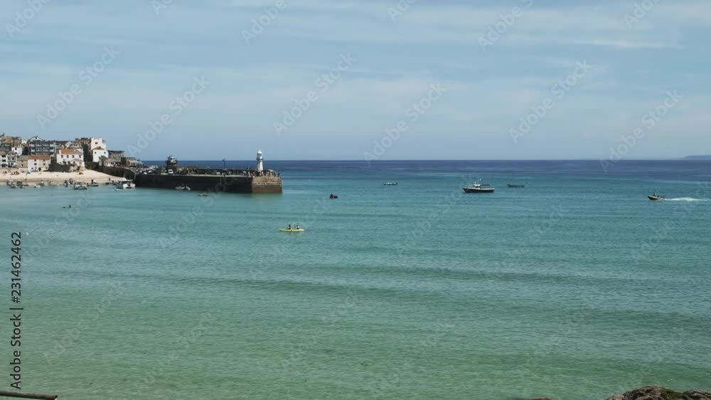 Views across clear blue sea towards St. Ives, Cornwall, England on a clear sunny June day. Views across clear blue sea towards St. Ives, Cornwall, England on a clear sunny June day.