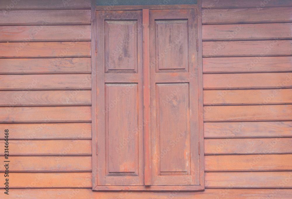 Vintage wooden window on wood wall in horizontal background